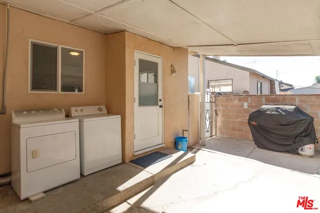 a bedroom with a bed and cabinets