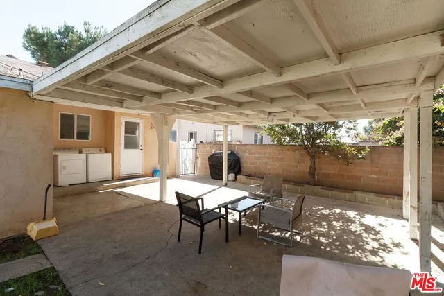 a outdoor space with lots of furniture and shower