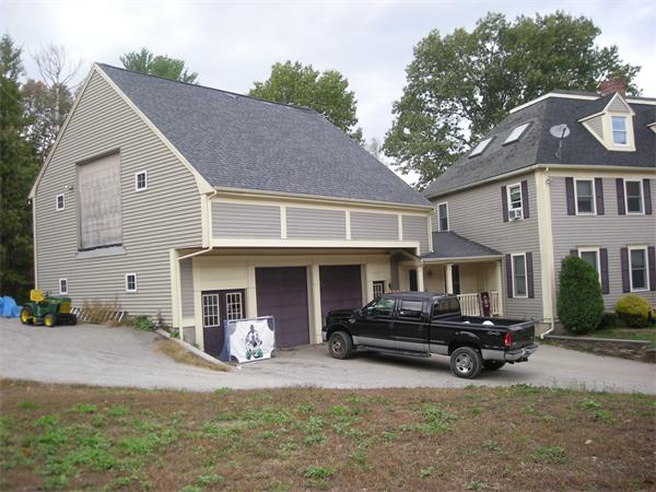 39 Middle Road, Unit B Newbury, MA 01951 - Photo 1 of 1 a front view of a house with cars parked