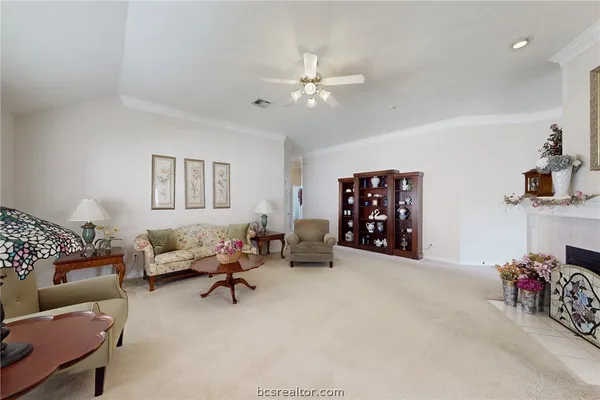 a bedroom with furniture and a window