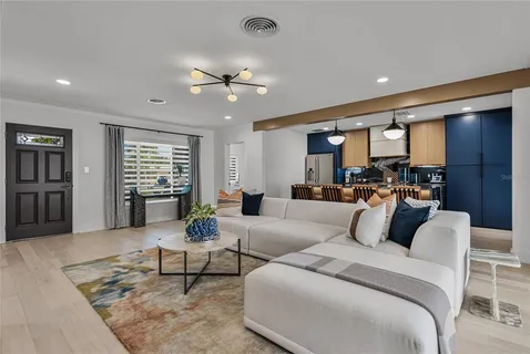 a kitchen with stainless steel appliances granite countertop a refrigerator sink and stove