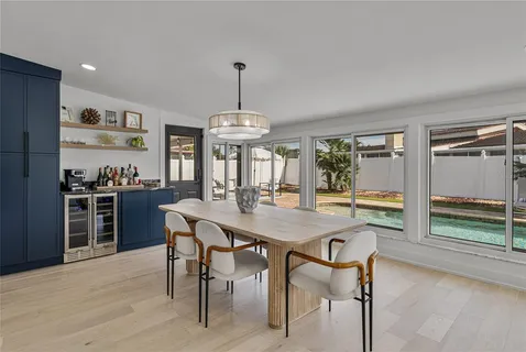 a bedroom with a bed couches chair and a window