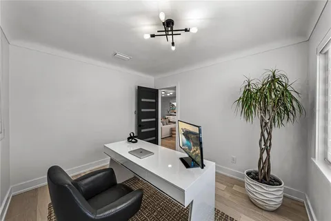 a view of a dining room with furniture and a livingroom