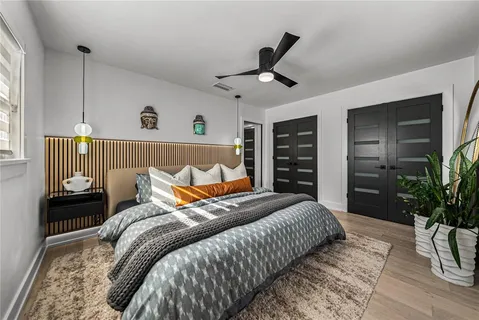 an aerial view of a city with lots of residential buildings and lake view in back