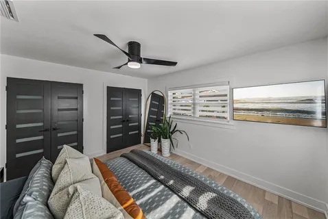 an aerial view of a city with lots of residential buildings lake and ocean view