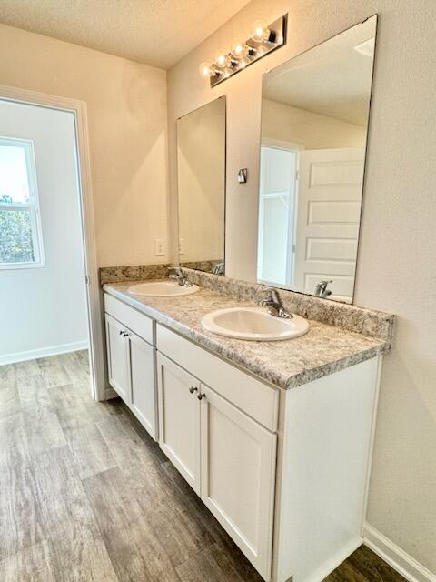 5414 Merlin Milton, FL 32583 - Photo 20 of 35 a bathroom with a granite countertop sink and a mirror
