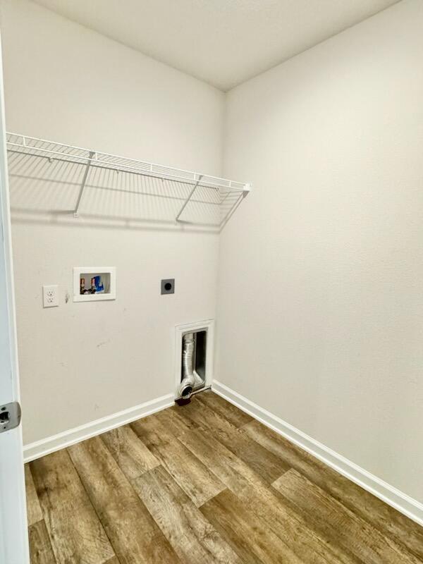 5414 Merlin Milton, FL 32583 - Photo 25 of 35 a view of a room with rack and wooden floor