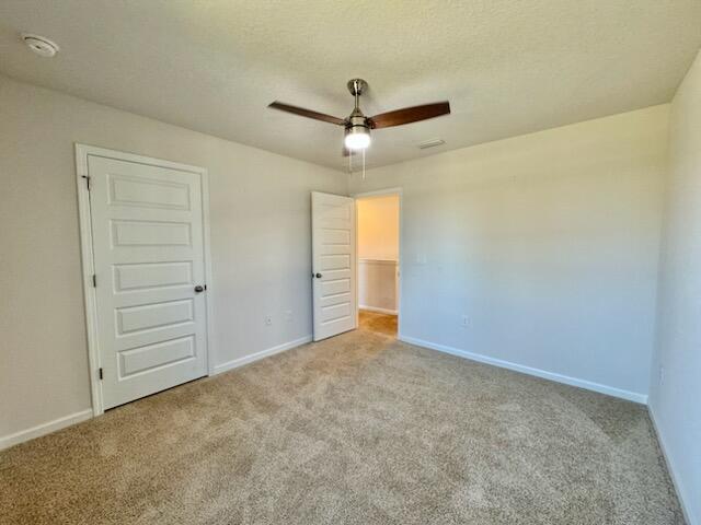 5414 Merlin Milton, FL 32583 - Photo 26 of 35 an empty room with closet and a ceiling fan