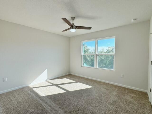 5414 Merlin Milton, FL 32583 - Photo 31 of 35 an empty room with windows and ceiling fan