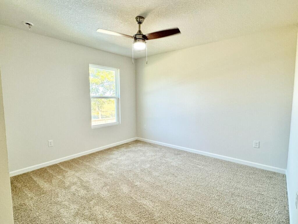 5414 Merlin Milton, FL 32583 - Photo 35 of 35 an empty room with a window and a fan