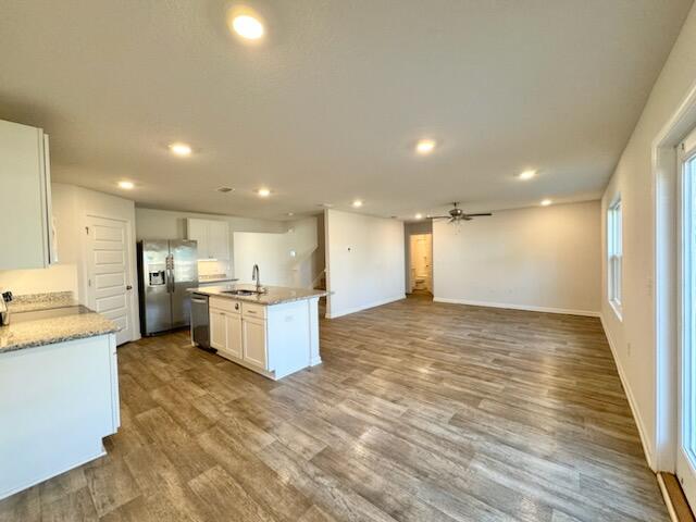 5414 Merlin Milton, FL 32583 - Photo 4 of 35 a view of kitchen with kitchen island wooden floor center island and stainless steel appliances