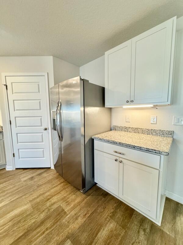 5414 Merlin Milton, FL 32583 - Photo 8 of 35 a kitchen with stainless steel appliances granite countertop a refrigerator and a sink