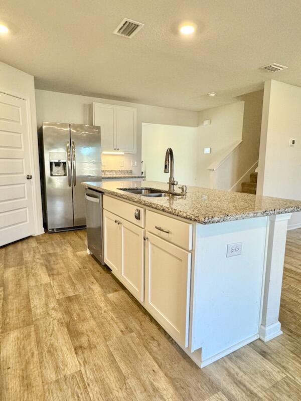5414 Merlin Milton, FL 32583 - Photo 10 of 35 a kitchen with a sink stove and refrigerator