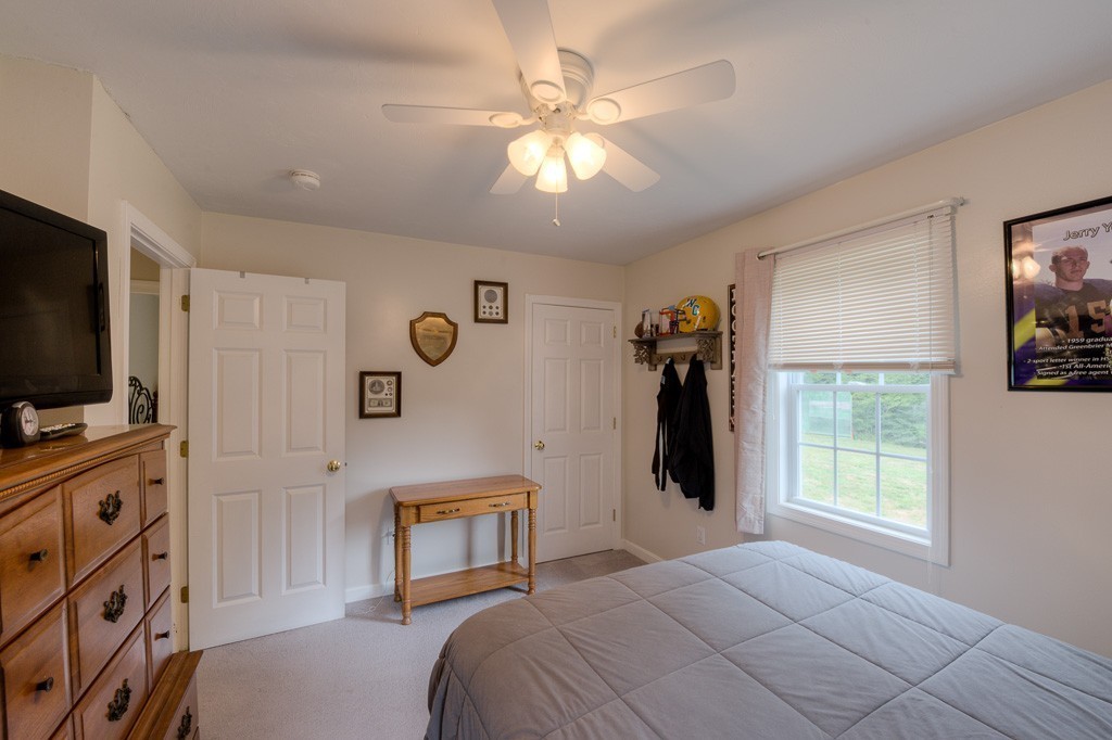 85 Old Reed Road Monson, MA 01057 - Photo 15 of 30 a bedroom with a bed and a flat screen tv