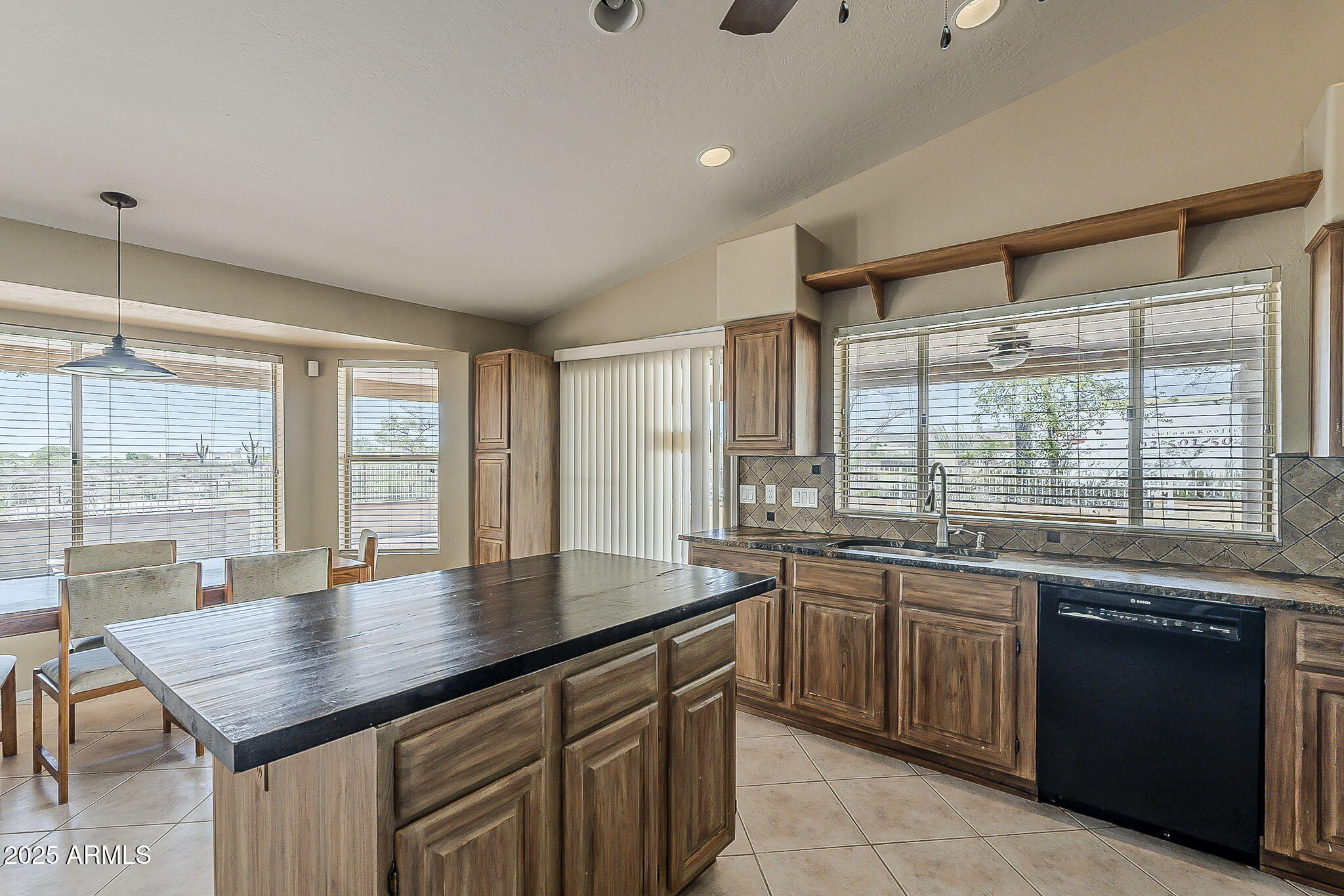 1410 North Goldfield Road Apache Junction, AZ 85119 - Photo 11 of 45 a kitchen with a sink stove and cabinets