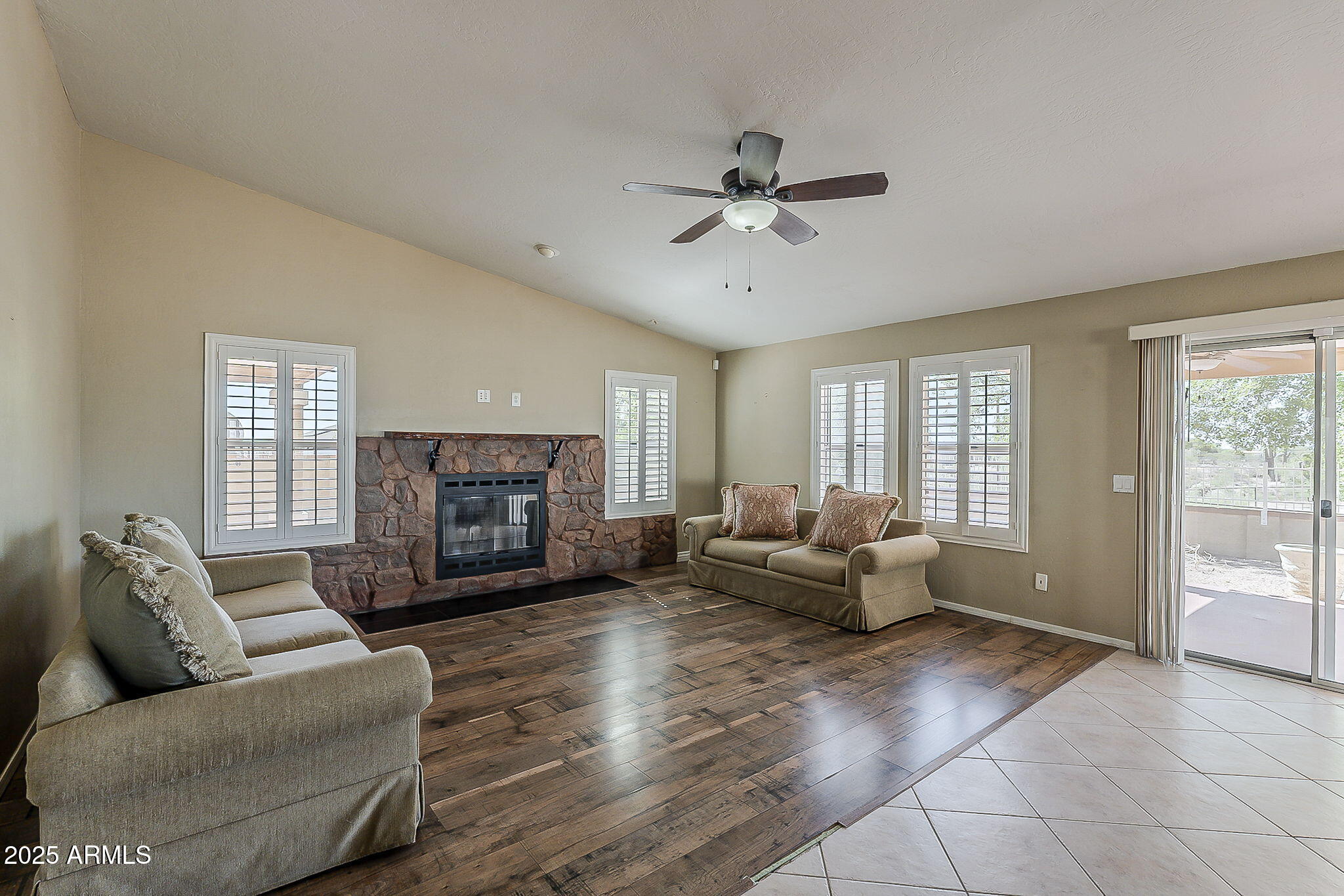 1410 North Goldfield Road Apache Junction, AZ 85119 - Photo 13 of 45 a living room with furniture and a fireplace