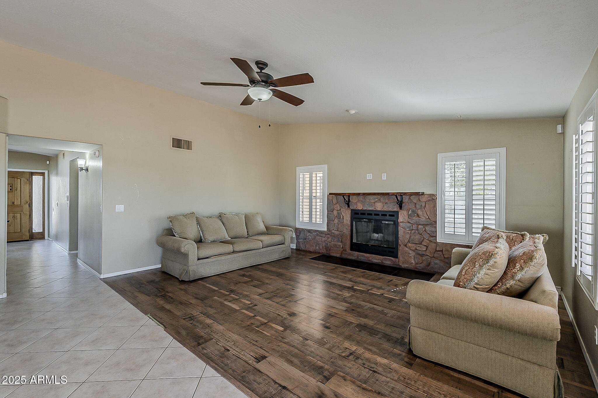 1410 North Goldfield Road Apache Junction, AZ 85119 - Photo 14 of 45 a living room with furniture and a fireplace
