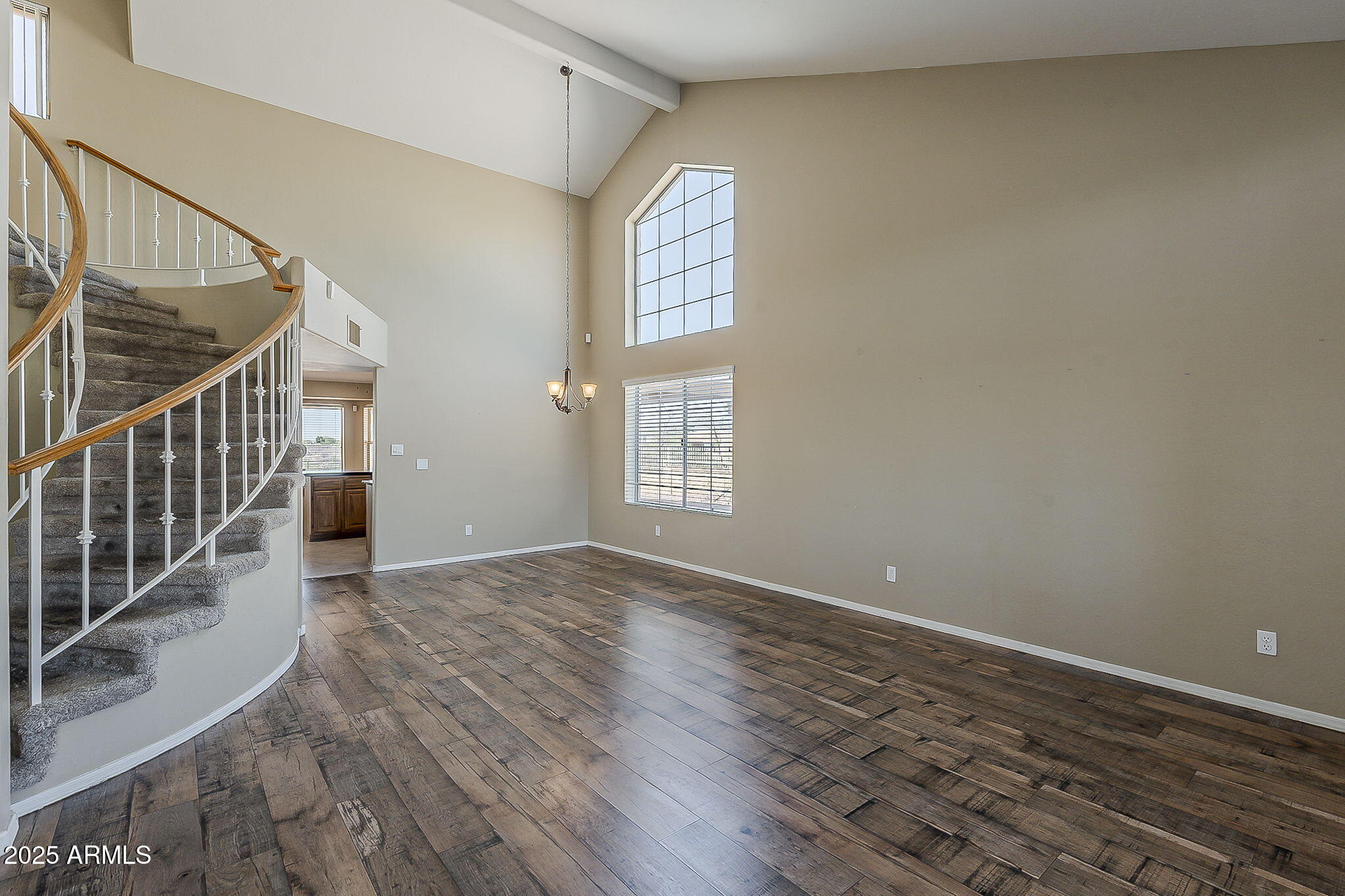 1410 North Goldfield Road Apache Junction, AZ 85119 - Photo 16 of 45 a view of an empty room with wooden floor and a window