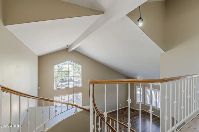 a view of a hallway with windows