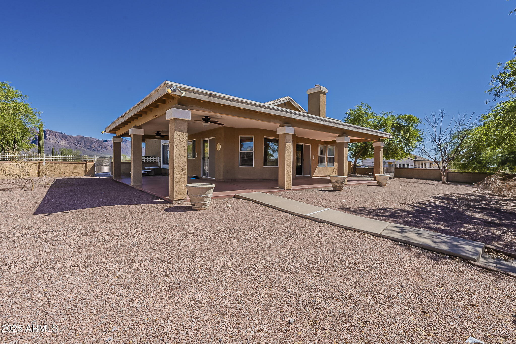 1410 North Goldfield Road Apache Junction, AZ 85119 - Photo 32 of 45 a front view of a house with a yard