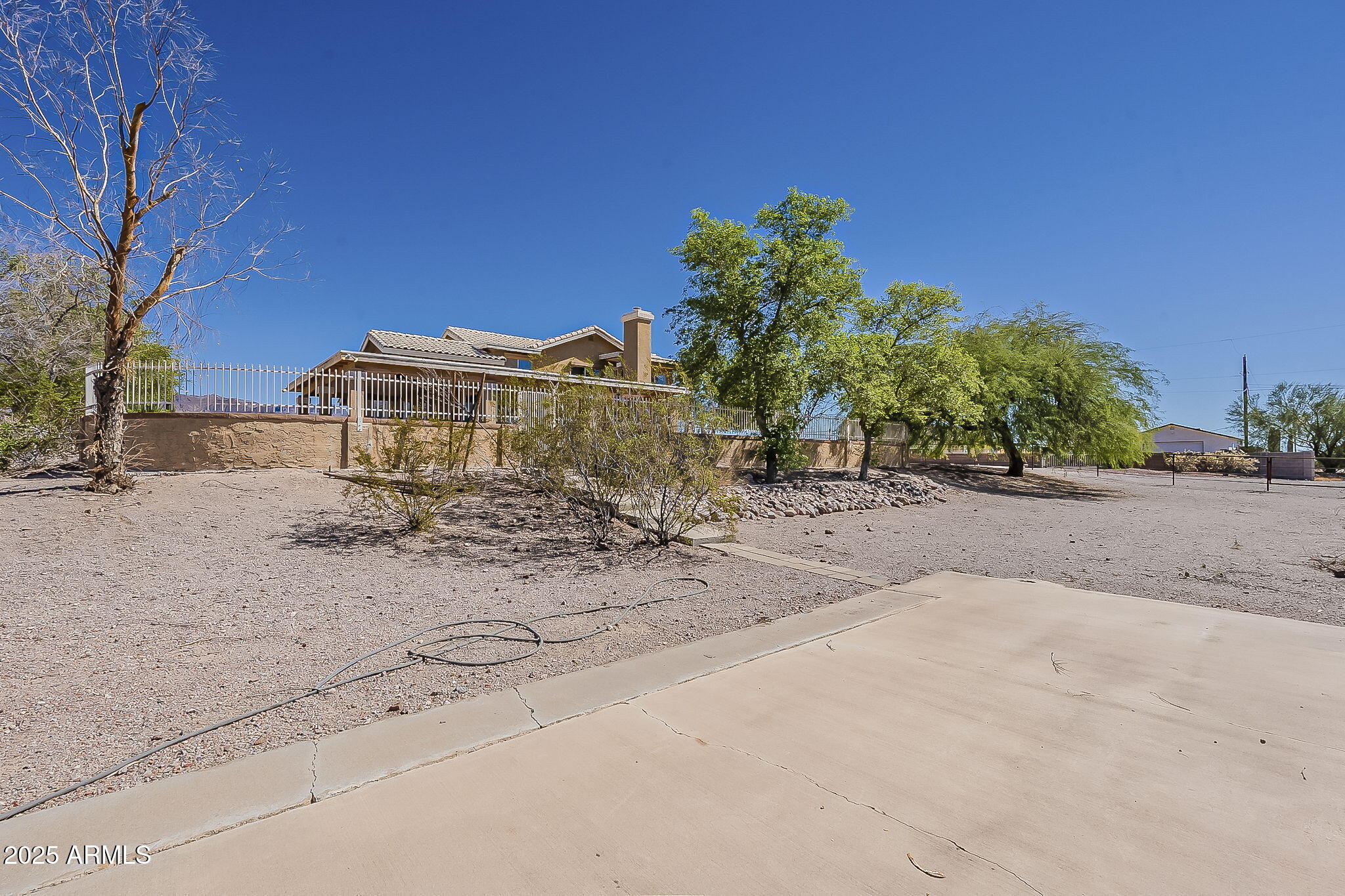 1410 North Goldfield Road Apache Junction, AZ 85119 - Photo 36 of 45 a view of a house with a snow on the road