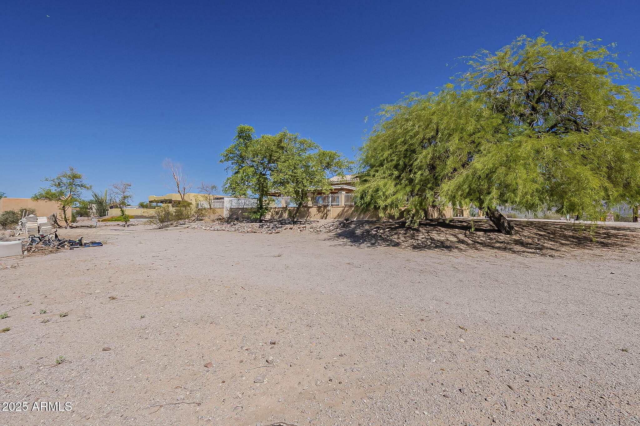 1410 North Goldfield Road Apache Junction, AZ 85119 - Photo 44 of 45 a view of dirt road with a building in the background