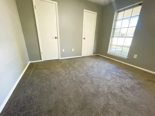 an empty room with windows