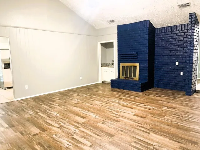 a view of a room with a fireplace