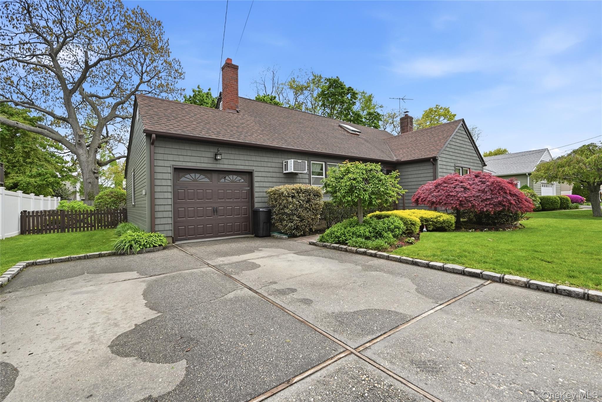 41 Lane Street Lindenhurst, NY 11757 - Photo 2 of 35 Expanded driveway with Belgium Block curbing, one car garage