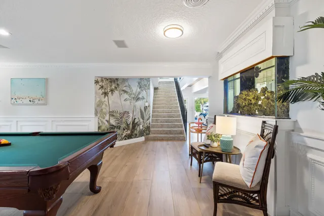 a view of a living room and furniture with wooden floor