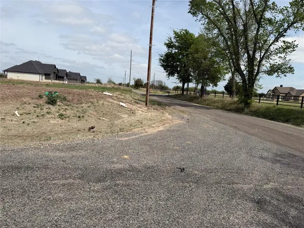 a view of a road with a yard
