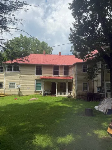 a view of a house with a swimming pool