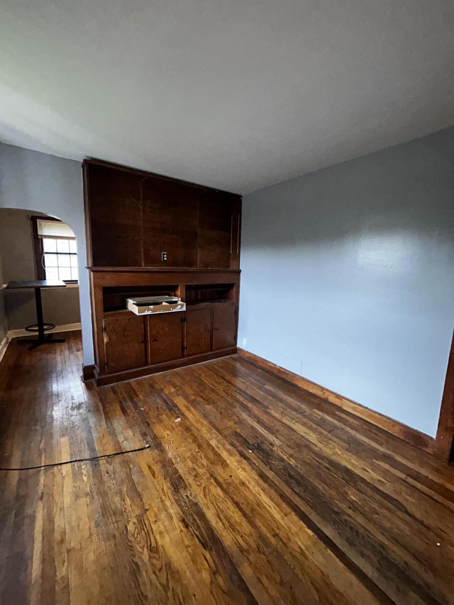 579-581 Botetourt Road Fincastle, VA 24090 - Photo 6 of 30 a view of kitchen and empty room with wooden floor