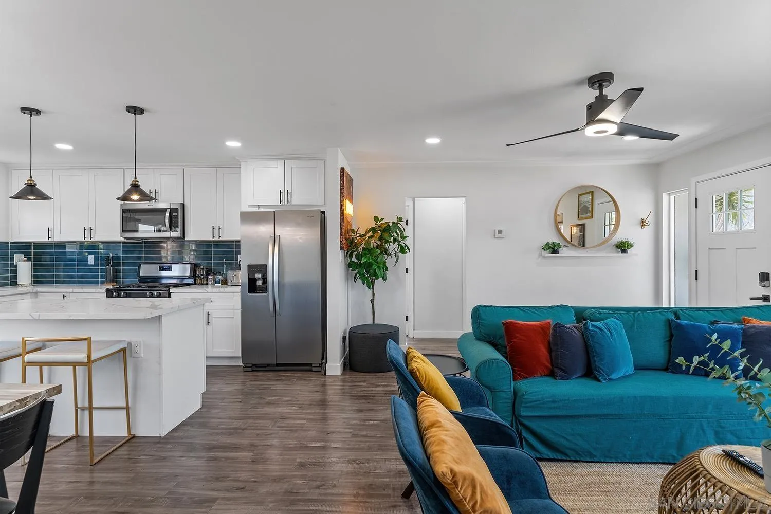 3109 Hawk Street San Diego, CA 92103 - Photo 11 of 75 a living room with stainless steel appliances furniture and a view of kitchen