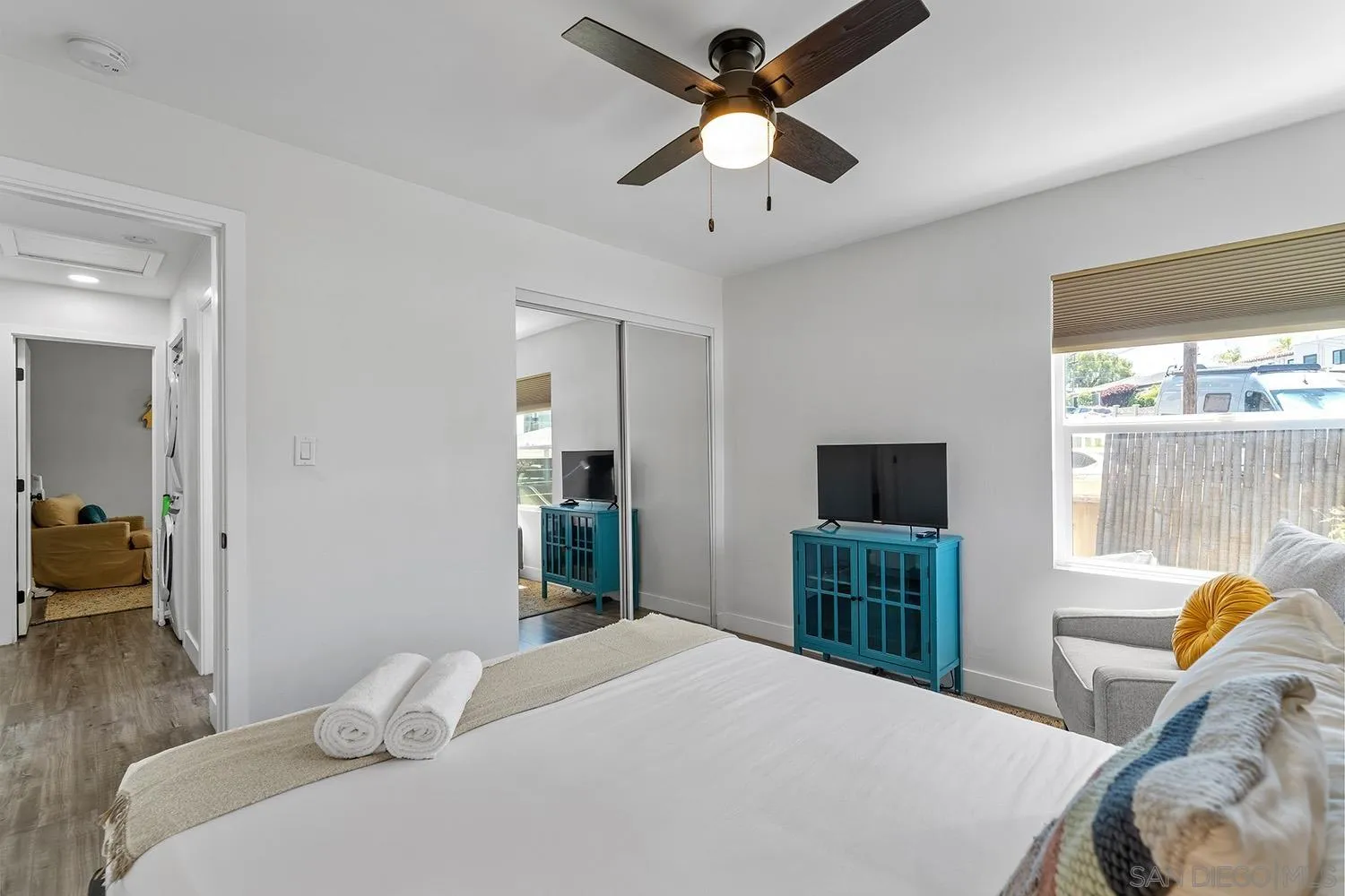 3109 Hawk Street San Diego, CA 92103 - Photo 39 of 75 a bedroom with a bed and a chandelier