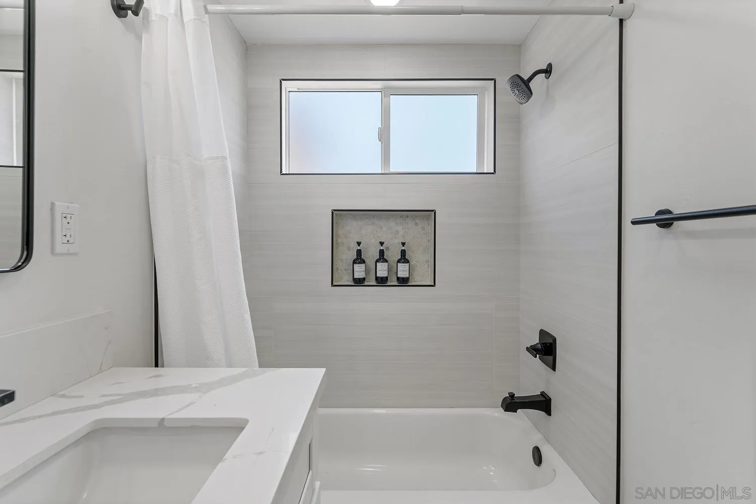 3109 Hawk Street San Diego, CA 92103 - Photo 40 of 75 a bathroom with a bathtub and a shower