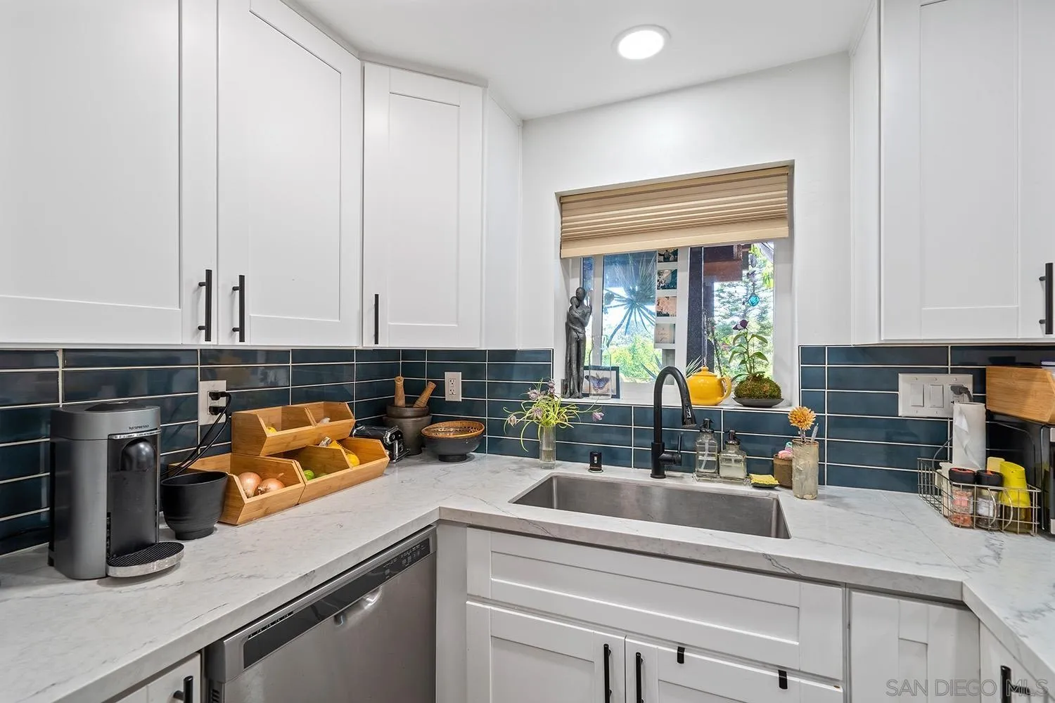 3109 Hawk Street San Diego, CA 92103 - Photo 60 of 75 a kitchen with a sink a counter and cabinets