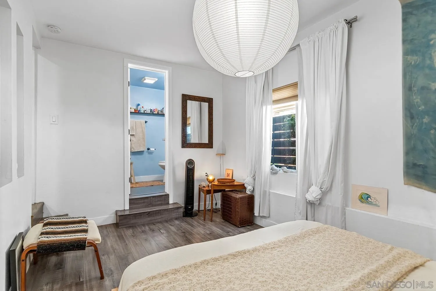 3109 Hawk Street San Diego, CA 92103 - Photo 68 of 75 a bedroom with a bed and wooden floor