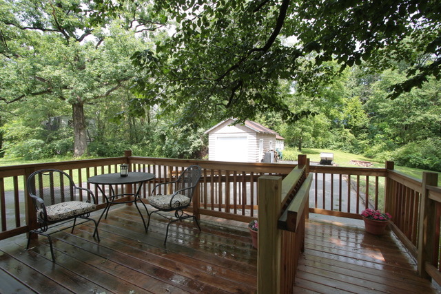 21455 Hillside Road Frankfort, IL 60423 - Photo 5 of 25 a view of balcony with wooden floor and outdoor seating