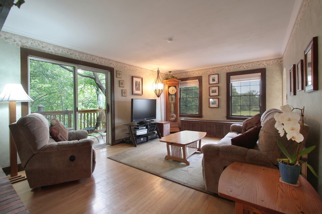 21455 Hillside Road Frankfort, IL 60423 - Photo 8 of 25 a living room with furniture tv and a large window
