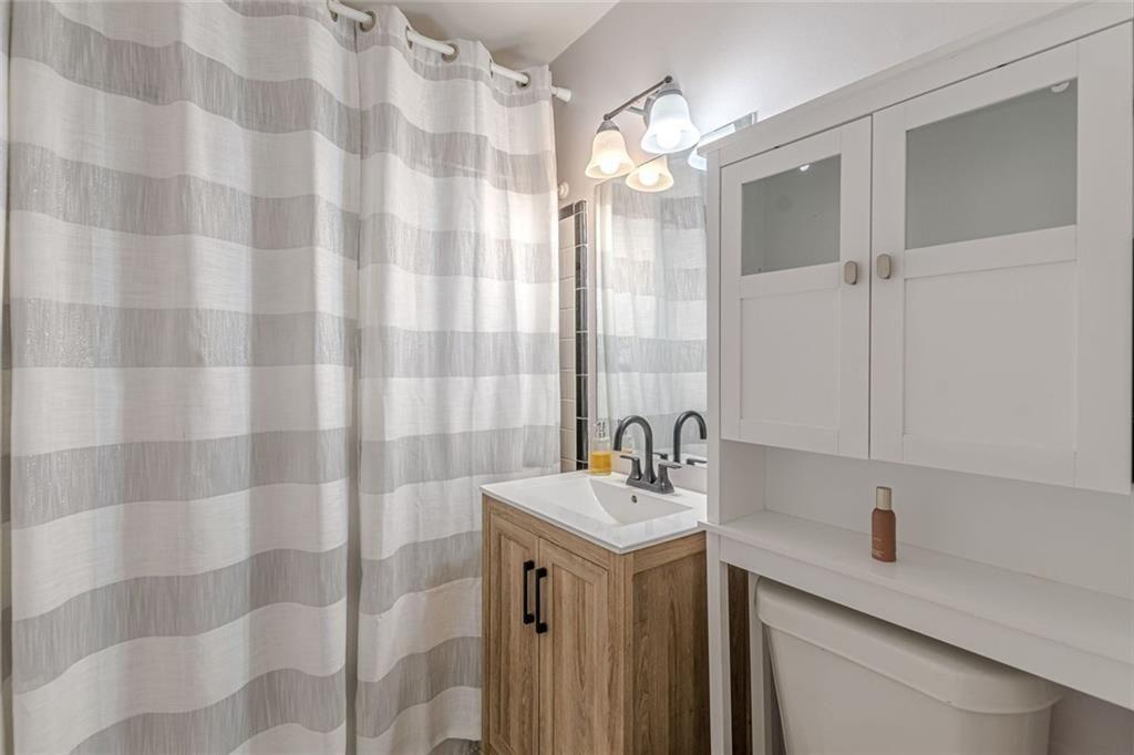 4558 Ryan Road Conley, GA 30288 - Photo 22 of 34 a bathroom with a double vanity sink mirror and shower