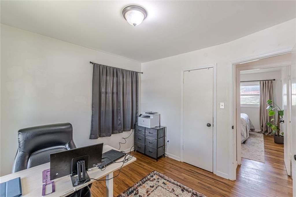 4558 Ryan Road Conley, GA 30288 - Photo 23 of 34 a room with furniture and wooden floor