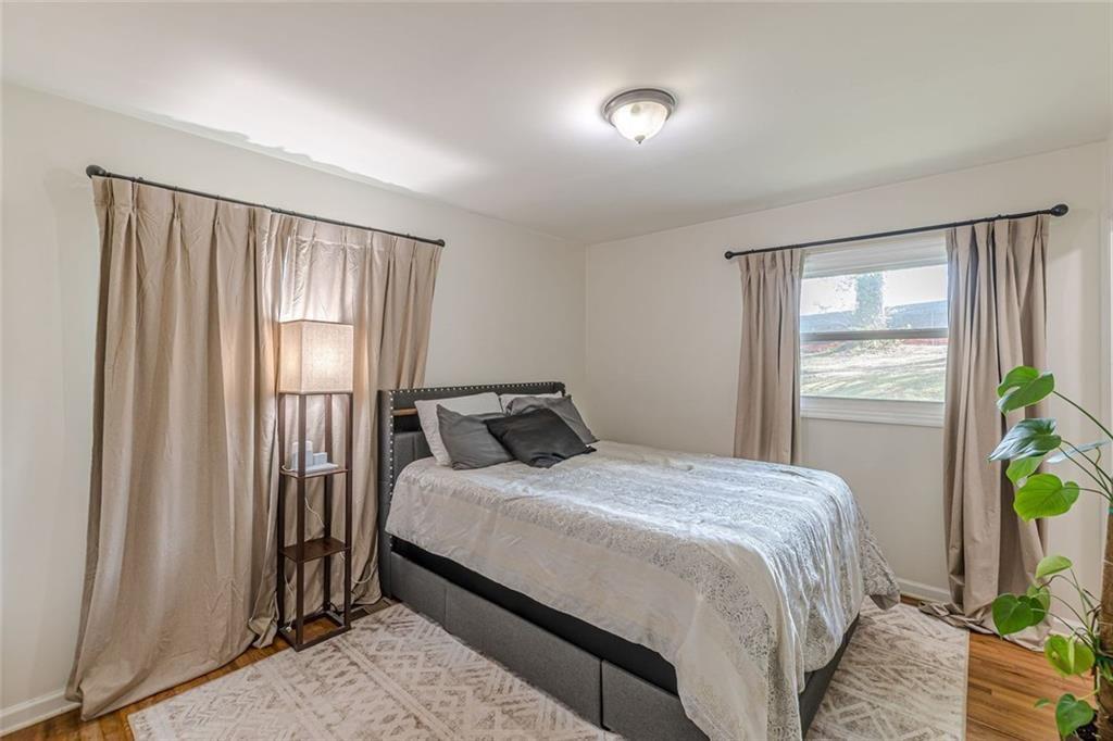 4558 Ryan Road Conley, GA 30288 - Photo 26 of 34 a bedroom with a bed and a window