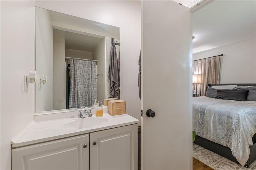 4558 Ryan Road Conley, GA 30288 - Photo 29 of 34 a en suite bathroom with a sink and a mirror