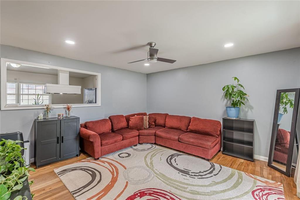 4558 Ryan Road Conley, GA 30288 - Photo 6 of 34 a living room with furniture and a rug