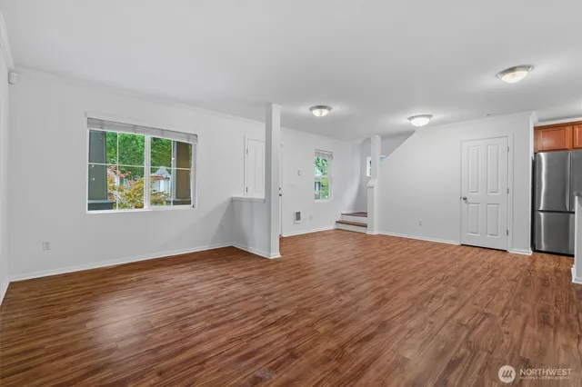 a view of a kitchen with wooden floor