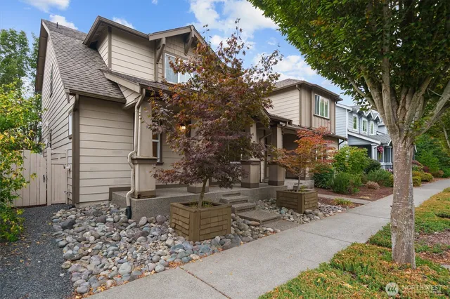 a front view of a house with garden