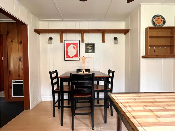 a view of a dining table and chairs in a room