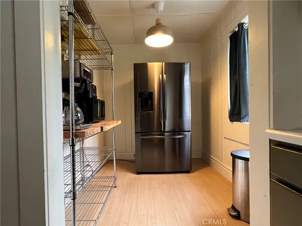 a view of a kitchen from the hallway