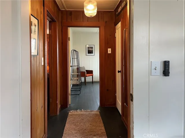 a hallway with kids room bathroom and bathroom view
